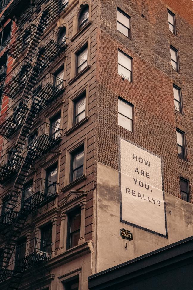 Building with a message displaying "HOW ARE YOU, REALLY?"